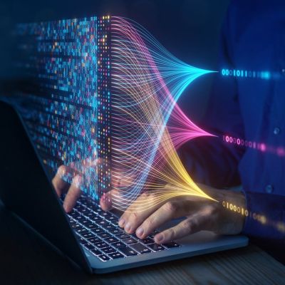 Person Using a Laptop With a Data Animation Above it