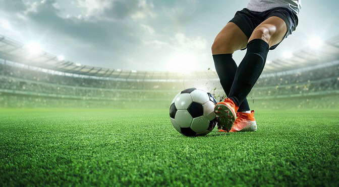 Footballer Controlling a Ball With the Side of His Left Foot