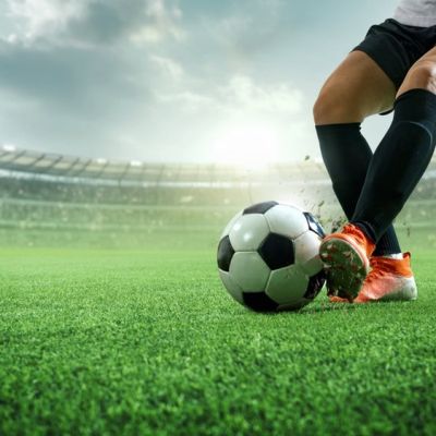 Footballer Controlling a Ball With the Side of His Left Foot