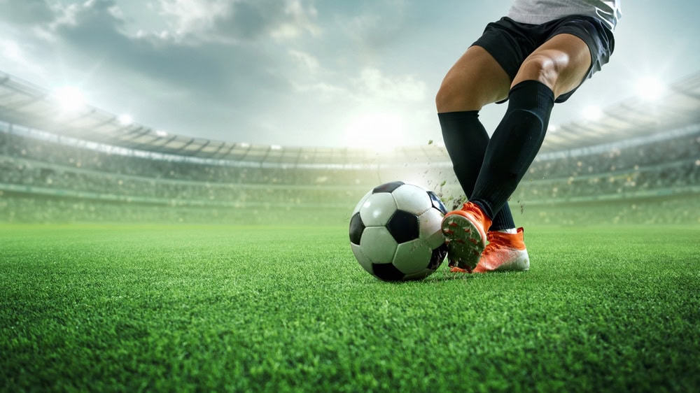Footballer Controlling a Ball With the Side of His Left Foot