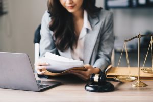 Lawyer Sitting at a Desk Reading Through Documents