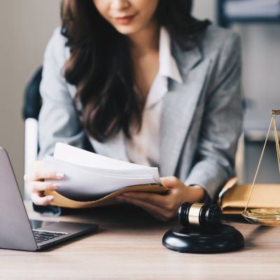 Lawyer Sitting at a Desk Reading Through Documents